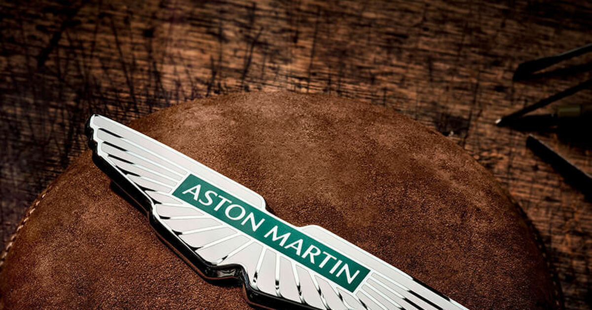 Иначе бренд. Aston Martin шильдик. Aston Martin logo шильд.